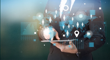 Business man with digital tablet and signs on background