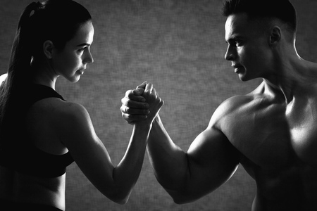 Bodybuilder couple fit lifting man weight woman blackの写真素材