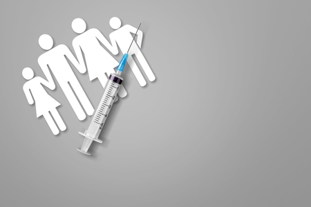 Vaccination for healthy family, vacctination of children. Flu. Syringe near family cutout on grey background top view copy spaceの写真素材