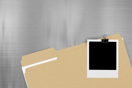 File Folder with Documents and Blank Polaroid