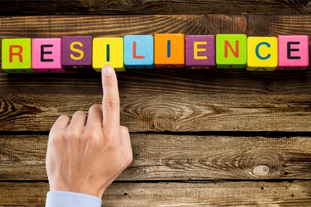 Resilience sign with wooden cubes on backgroundの写真素材