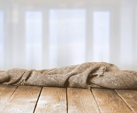 Burlap texture on wooden table on blurredの写真素材