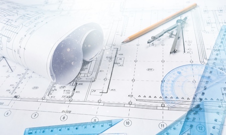 Industrial drawing detail and several drawing tools on deskの写真素材