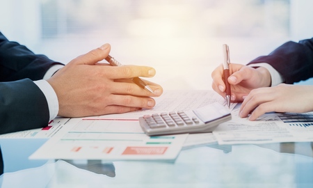 Business startup analysis summary report graph and using a calculator to calculate the numbers.