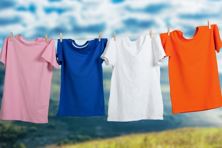 Wash clothes on a rope with clothespinsの写真素材