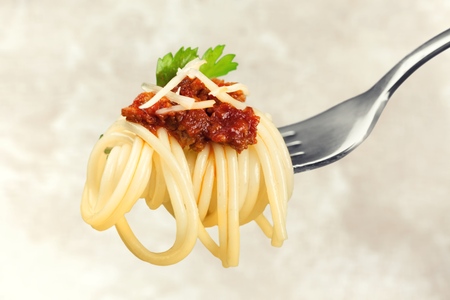 Fork with just spaghetti around it on backgrouundの写真素材