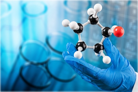 Scientist man  holding molecule form isolated on background,close up