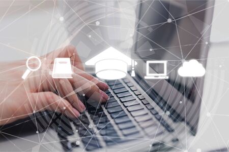 Online education, e-learning and e-book concept. a man using digital tablet for education, with education and online learning media iconsの写真素材