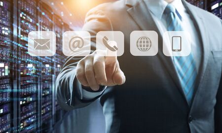 Businessman pressing phone button