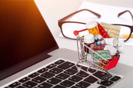 Mini shopping cart full of pillの写真素材