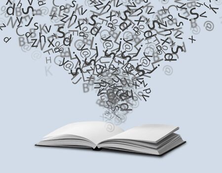 Dictionary with letters flying outの写真素材
