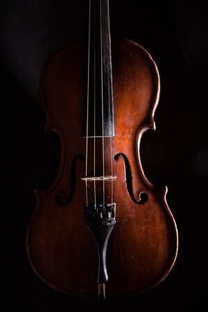 Front View of a Violin, Isolated on Blackの写真素材