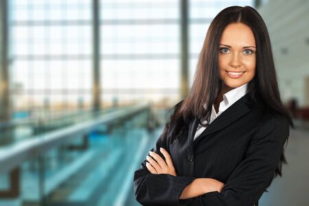 Portrait of a young  businesswoman  on background