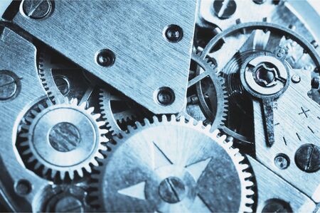 Close up view of watch mechanism in blue tones. Macro shot
    
    - Image