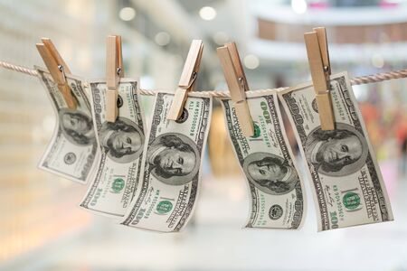 American dollars in a rope on backgroundの写真素材