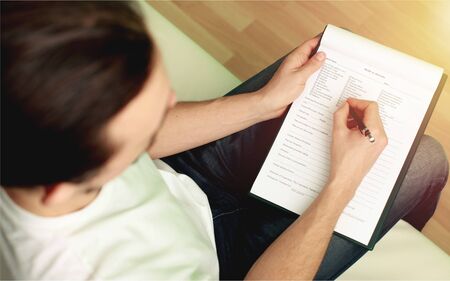 Female counselor writing down some information aboutの写真素材