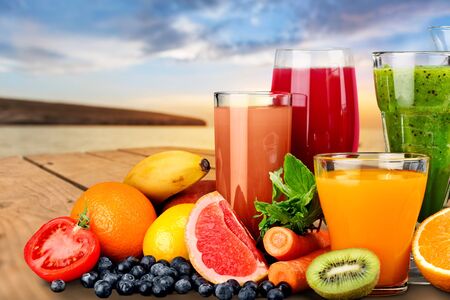 Tasty fruits and juice with vitaminsの写真素材