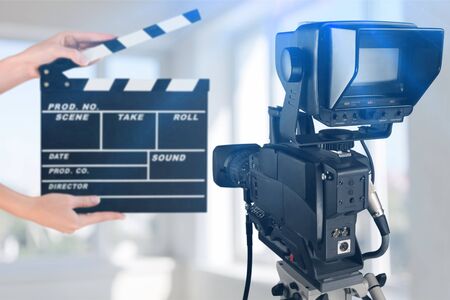 Man hands holding movie clapper