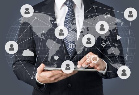 Businessmen hand touch screen at digital tabletの写真素材