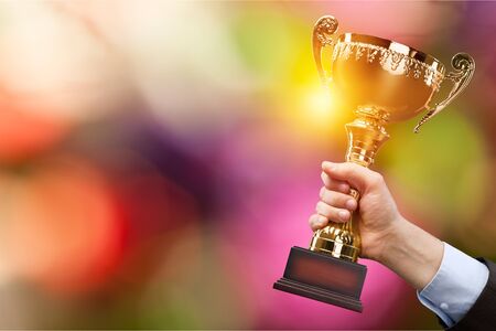 Champion golden trophy for winner background. Success and achievement concept. Sport and cup award theme.の写真素材