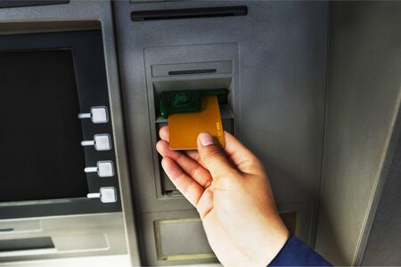 Atm bank banking paper currency bank teller removing currencyの写真素材
