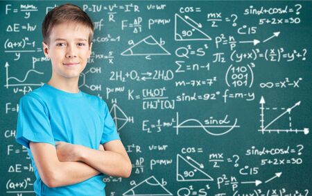 Little school man on blackboard background
