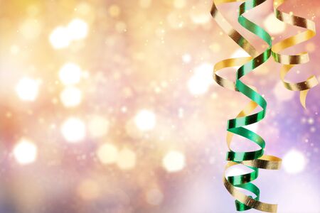 Close up of  gold and green ribbons on white backgroundの写真素材