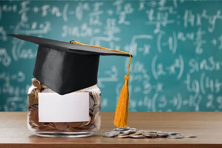 hat graduation model on money coins saving for concept investment education and scholarship
    
    - Imageの写真素材