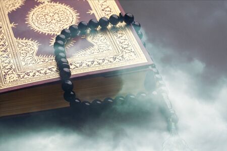 Islamic Holy Quran and Subha on Soft Light Background