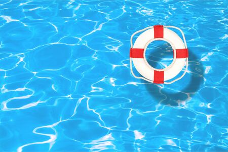 Life preserver floating in a clear pool waterの写真素材