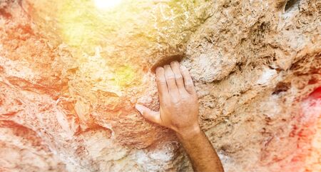 male left hand with chalk powder in cliff climbing sport, Ao Nang, Krabi, Thailandの写真素材