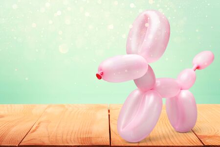 Pink balloon in form of dog on backgroundの写真素材