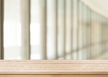 Design wooden table with blur bokeh backgroundの写真素材
