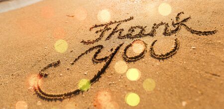 Thank you inscription on sandy sea beachの写真素材