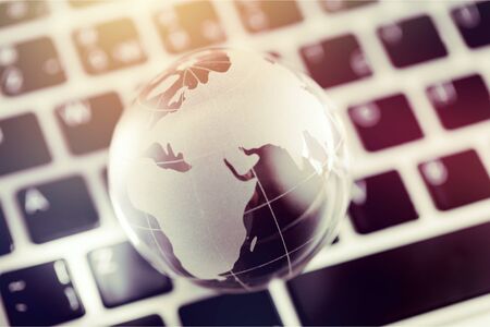 Online E-Learning education by Technology concept : Australia Educational knowledge learning study abroad international Ideas. Glass earth globe on laptop keyboard, Studies from anywhere anytime
    
    - Imageの写真素材