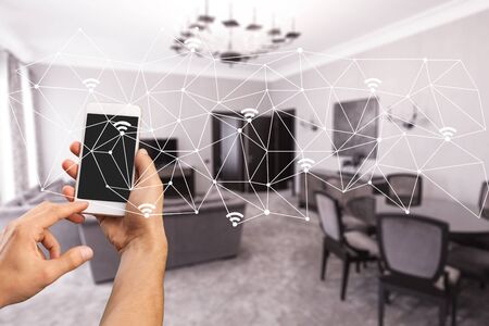modern smarthome living room controlled by man holding a smartphone
    
    - Imageの写真素材