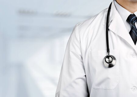 Portrait of  doctor  with arms crossed in medical officeの写真素材