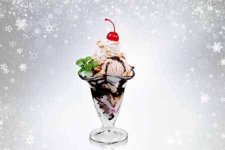 Scoops of ice cream with syrup on backgroundの写真素材