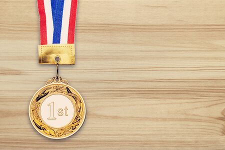 Golden medal on deskの写真素材
