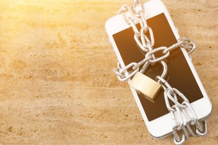Modern smartphone with combination lock padlock. Concept of mobile phone security