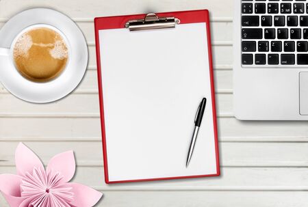 Office desk table with computer, supplies,  cup of coffee and peony flowers. White wooden background. Coffee break,  ideas, notes or plan writing concept. Top view, flat lay.の写真素材