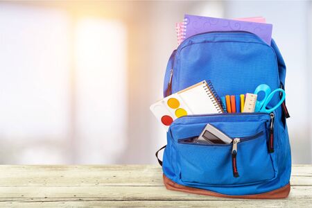 School Backpack with stationery on backgroundの写真素材