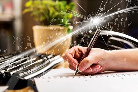Female hand writting report at office workplace