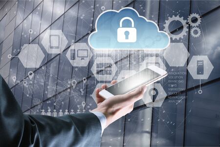 Businessman use smartphone with virtual screen padlock and Interface Icons over the Network...