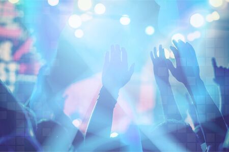 Crowd raising their hands and enjoying great festival party.の写真素材
