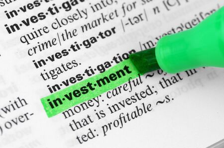 Close Up of Highlighting Specific Word Investment in a Dictionaryの写真素材