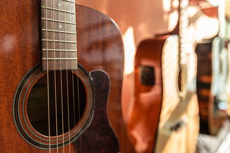 Three Guitars Standing in Shop - Close Upの写真素材
