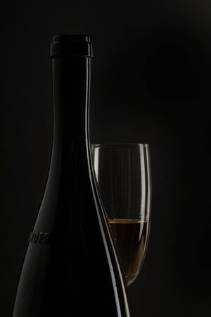 Champagne in a champagne flute with a dark backgroundの写真素材