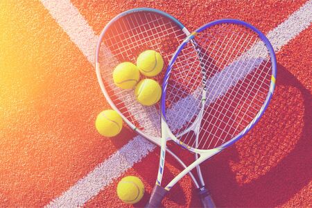Tennis game. Tennis balls and rackets on  background.の写真素材
