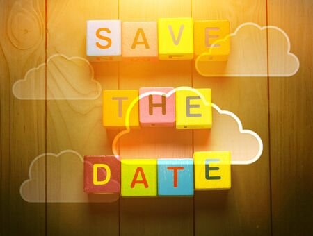 Tablet pc with text Save the Date with sky backgroundの写真素材